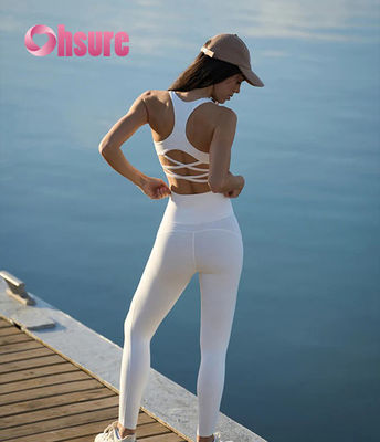 Leggings da palestra svasati a vita alta con motivo a tinta unita, pantaloni da yoga con vita incrociata per donna, leggings sportivi alla moda per ragazze