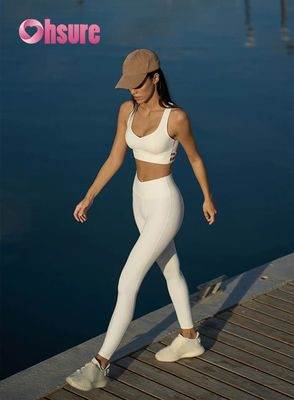 Leggings da palestra svasati a vita alta con motivo a tinta unita, pantaloni da yoga con vita incrociata per donna, leggings sportivi alla moda per ragazze