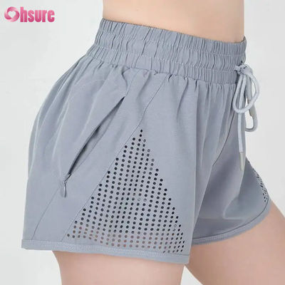 Giubbotti da allenamento sportivo per donne al dettaglio Breathable Laser Cut Jogging Shorts with Warm-up Zipper Side Pocket Solid Pattern