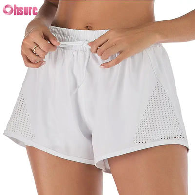 Giubbotti da allenamento sportivo per donne al dettaglio Breathable Laser Cut Jogging Shorts with Warm-up Zipper Side Pocket Solid Pattern