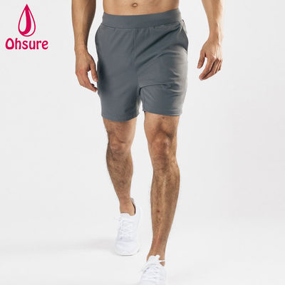OEM Disegno del logo personalizzato Materiale leggero Stretta a quattro vie Tasche anteriori profonde Uomini Sport Shorts Gym Training Shorts